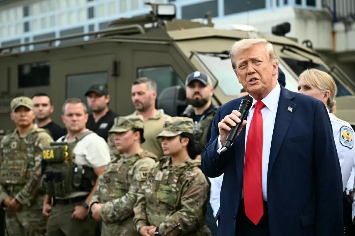 Trump rows back from tariff threat after scathing Davos speech