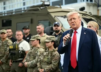 Trump rows back from tariff threat after scathing Davos speech