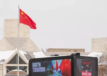 ‘The Invisible Coup’ Billboard Truck Takes Birth Tourism Bombshell to China’s Embassy Doorstep